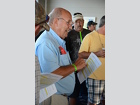 MCAC Volunteer and Sponsor Jim Weix of The Real Estate Company of the Treasure Coast reads the rules at the Captain's Meeting Friday night.